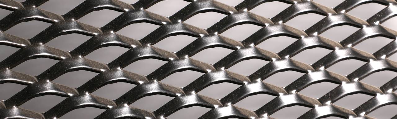 Expanded metal sheet with fish-scale mesh opening.
