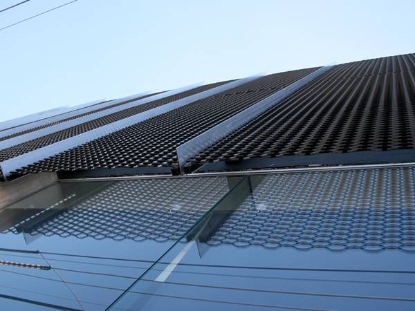 The functional sun screen is installed with expanded metal panels.