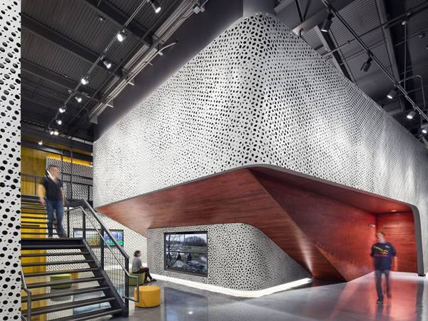 A building interior wall designed with oval hole pattern.