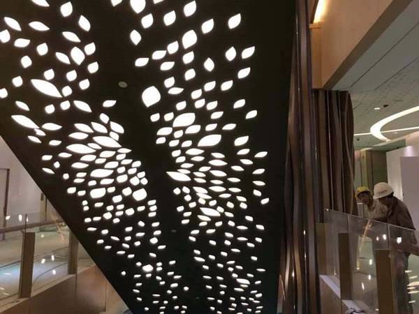 PVDF coated aluminum perforated panels are installed as shopping mall curtain wall.