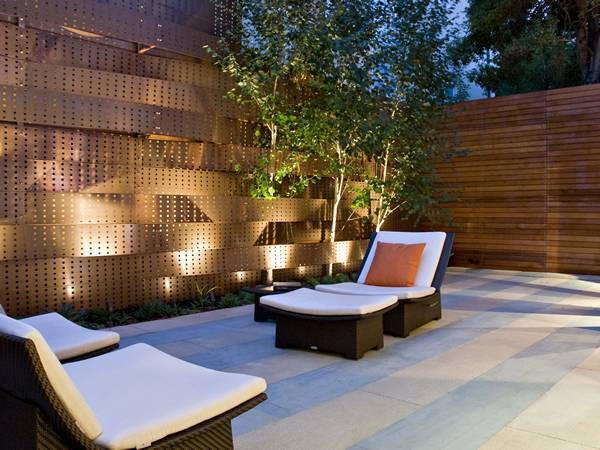 Front yard fence designed with perforated copper panels.