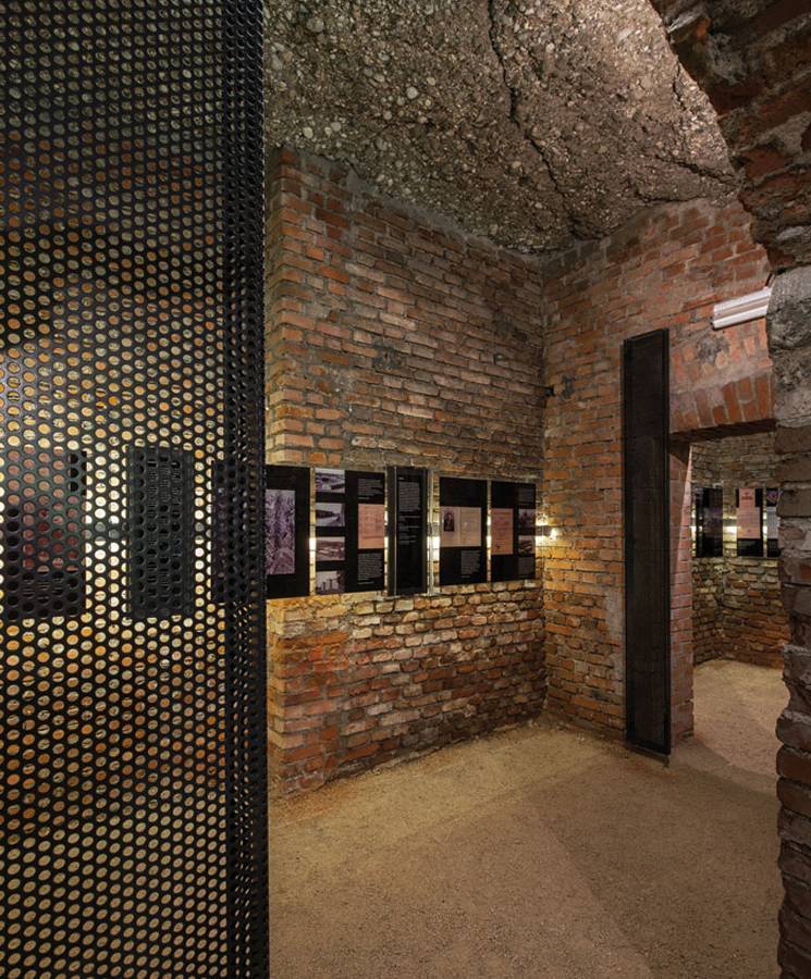 Perforated metal panels are installed as space partition wall in exhibition.