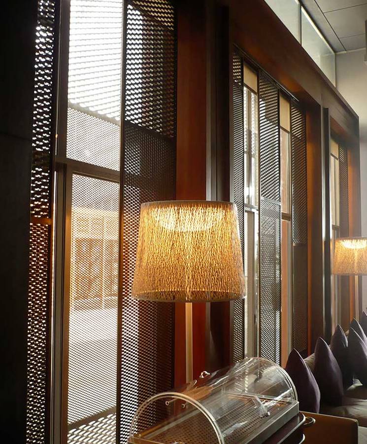 The internal wall panel of this upscale club is designed with expanded metal sheets.