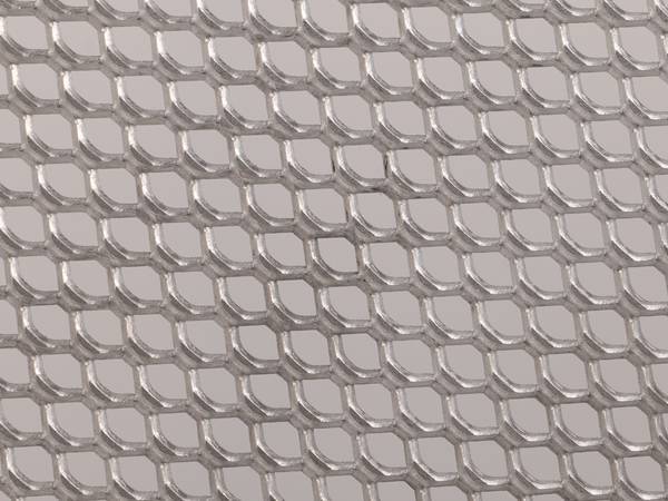 Aluminum expanded metal sheet with honeycomb style opening.