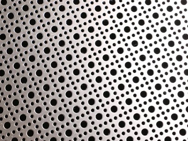 Perforated stainless steel sheet with ornament round pattern.