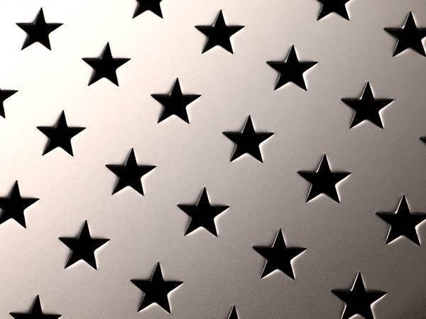 Perforated aluminum sheet with pentagram shaped holes.