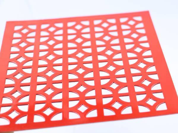Red steel perforated metal sheets with Egyptian pattern.