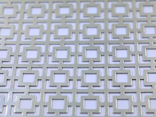 Aluminum perforated metal sheets with cross pattern.