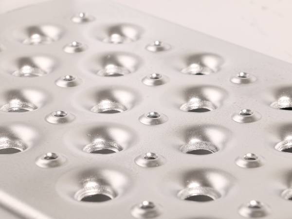 Stainless steel O-grip safety grating with hole size of 15 mm.