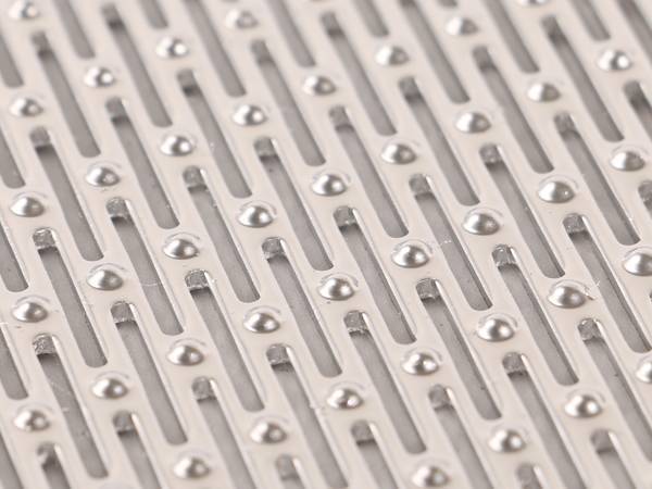 Stainless steel perforated metal sheet with slotted holes.