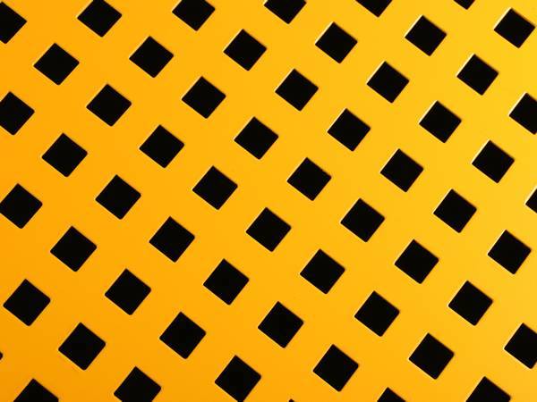 Yellow perforated steel sheet with square holes.