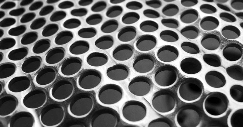 A perforated corrugated sheet with round holes