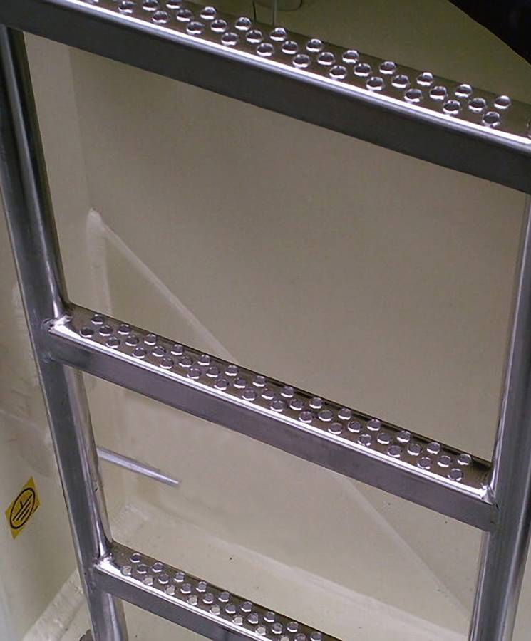 There is a steel traction tread safety grating ladder.