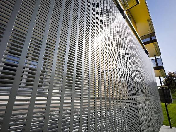 Perforated galvanized steel sheets are installed for balcony & corridor decoration.