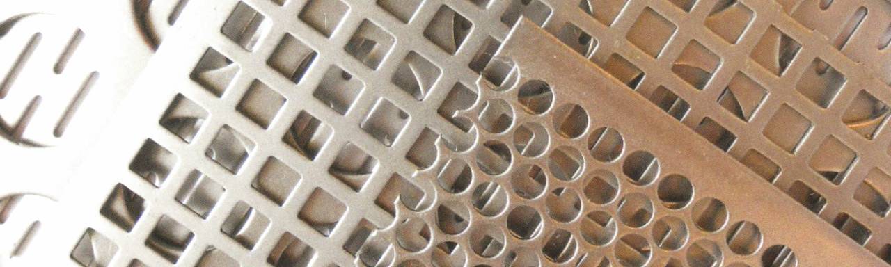 There are two pieces of perforated steel sheets with different hole shapes.