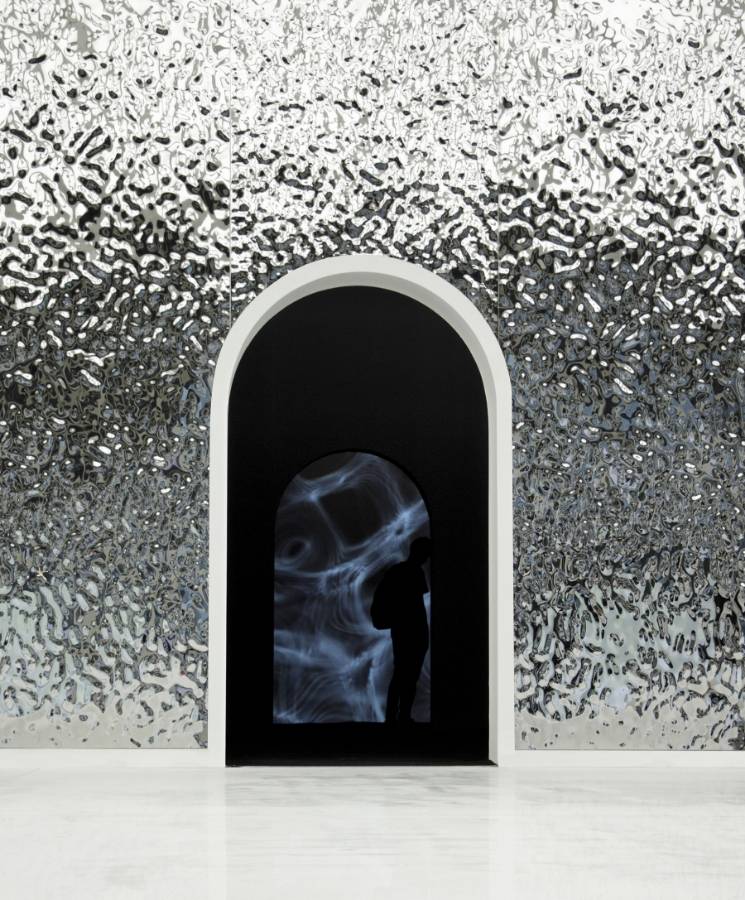 Internal walls at the entrance of the exhibition decorated with water ripple sheets