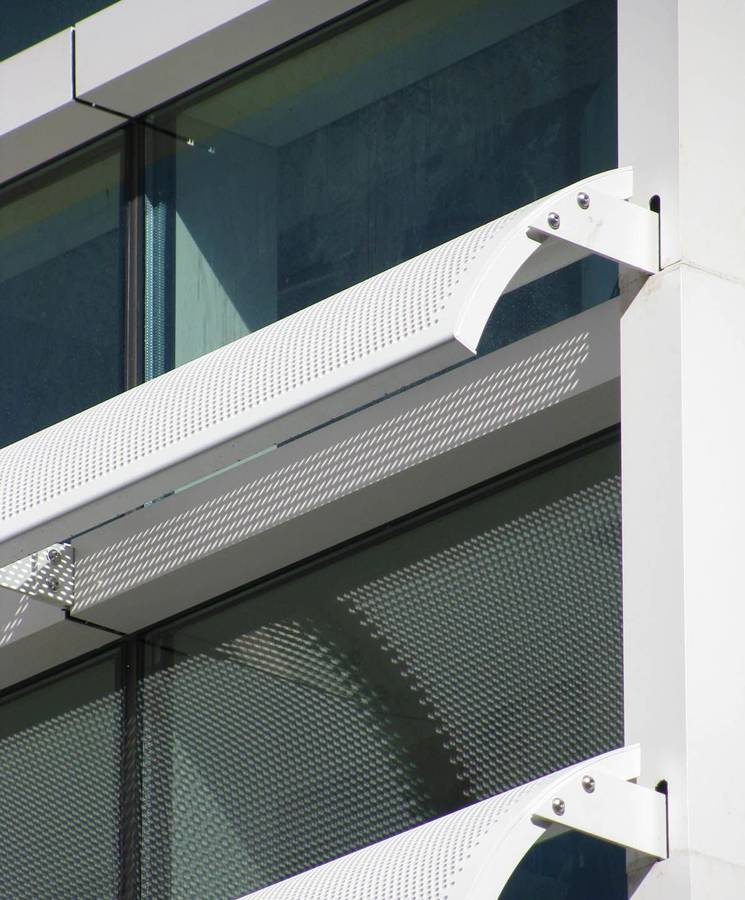 Architectural perforated metal sunshades with white color.