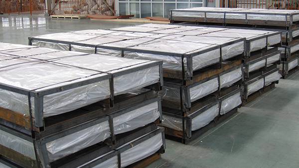 Perforated metal sheets packed with bubble film are placed in the yard.